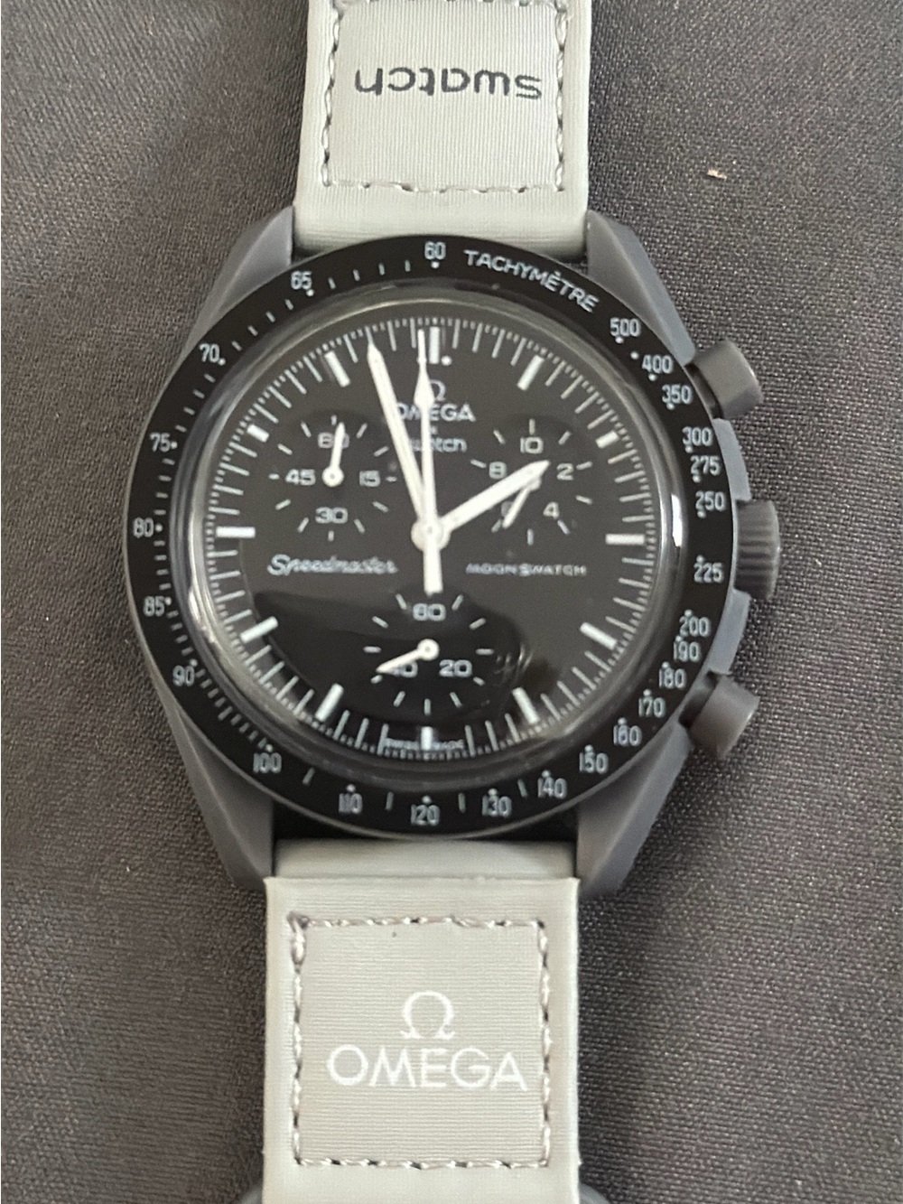 Swatch Omega black speedmaster light gray strap